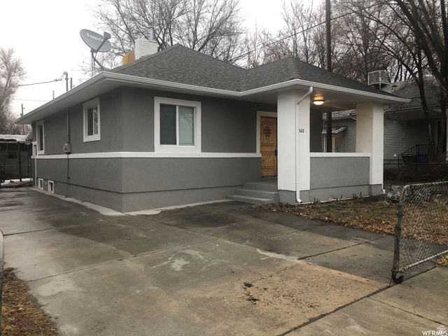 566 31st Street Ogden, UT 84403 - Photo 1 of 1 View of front of property with stucco siding, a shingled roof, and a chimney
