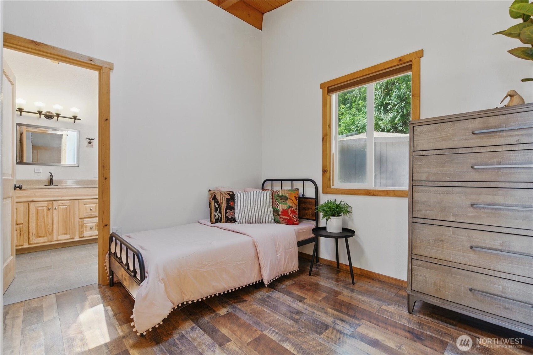 6570 East Grapeview Loop Road Allyn, WA 98524 - Photo 11 of 38 a bedroom with a bed and a window