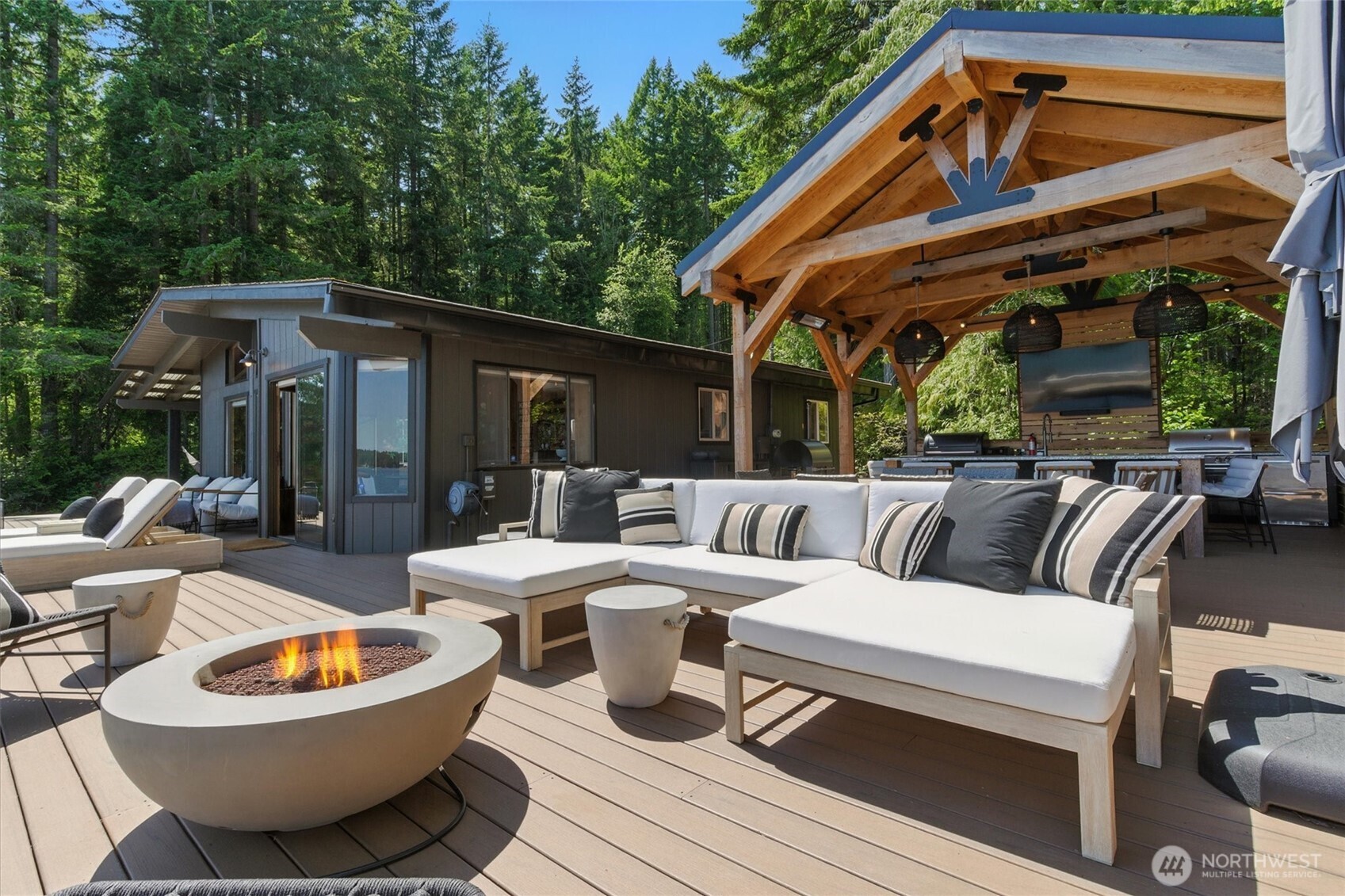 6570 East Grapeview Loop Road Allyn, WA 98524 - Photo 12 of 38 a outdoor space with patio the couches and a dining table with chairs and a barbeque