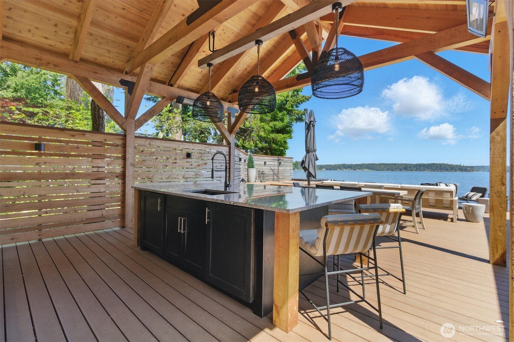 6570 East Grapeview Loop Road Allyn, WA 98524 - Photo 14 of 38 a view of swimming pool with a table and chairs