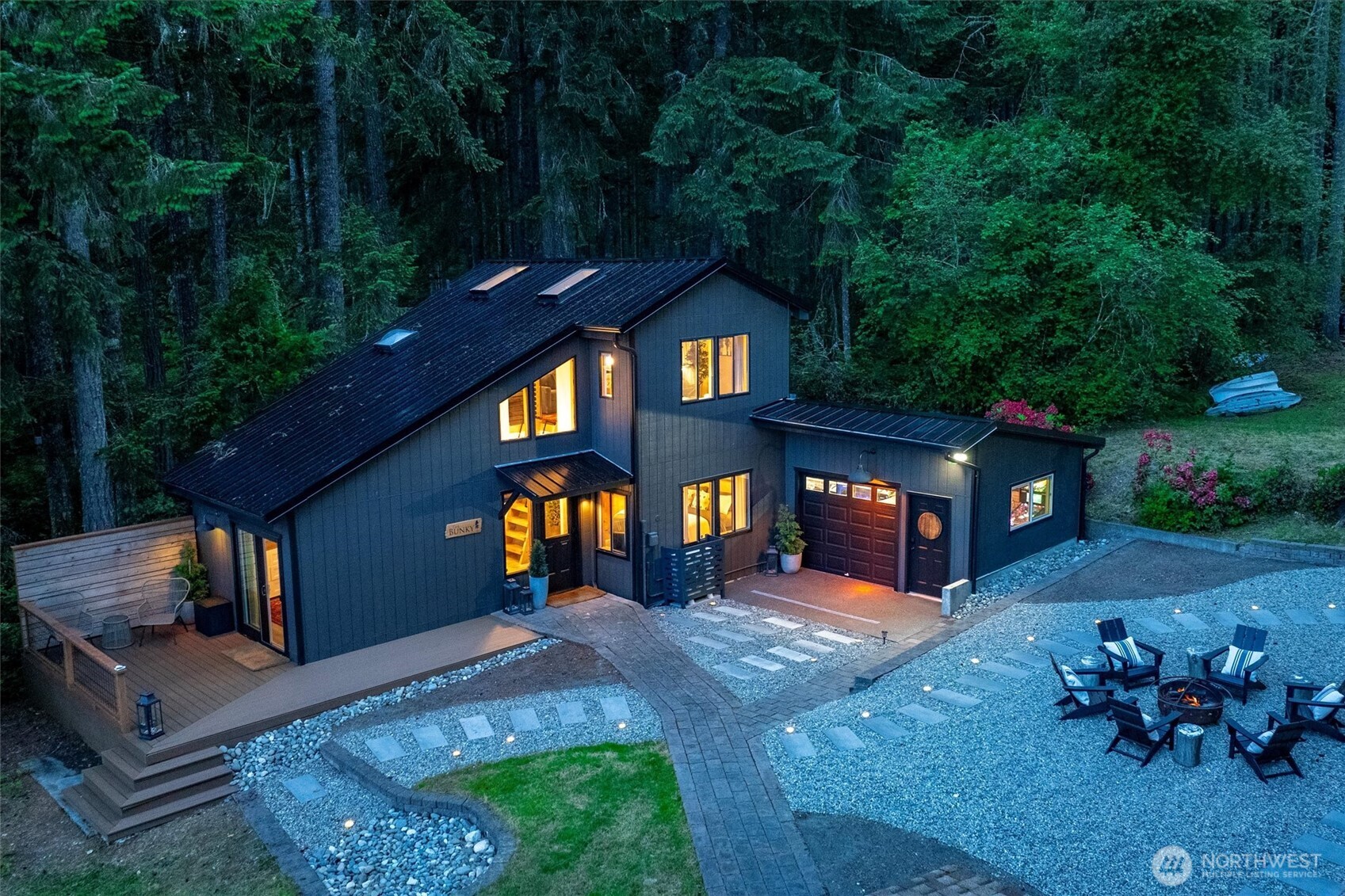 6570 East Grapeview Loop Road Allyn, WA 98524 - Photo 19 of 38 a front view of a house with a yard