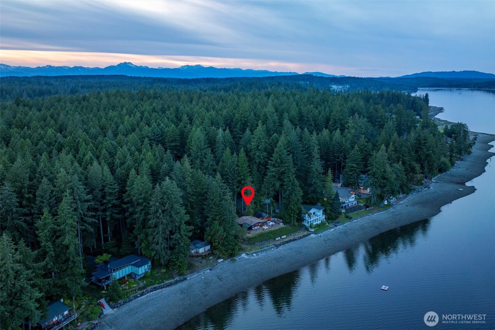 6570 East Grapeview Loop Road Allyn, WA 98524 - Photo 2 of 38 a view of a lake with a mountain in the background