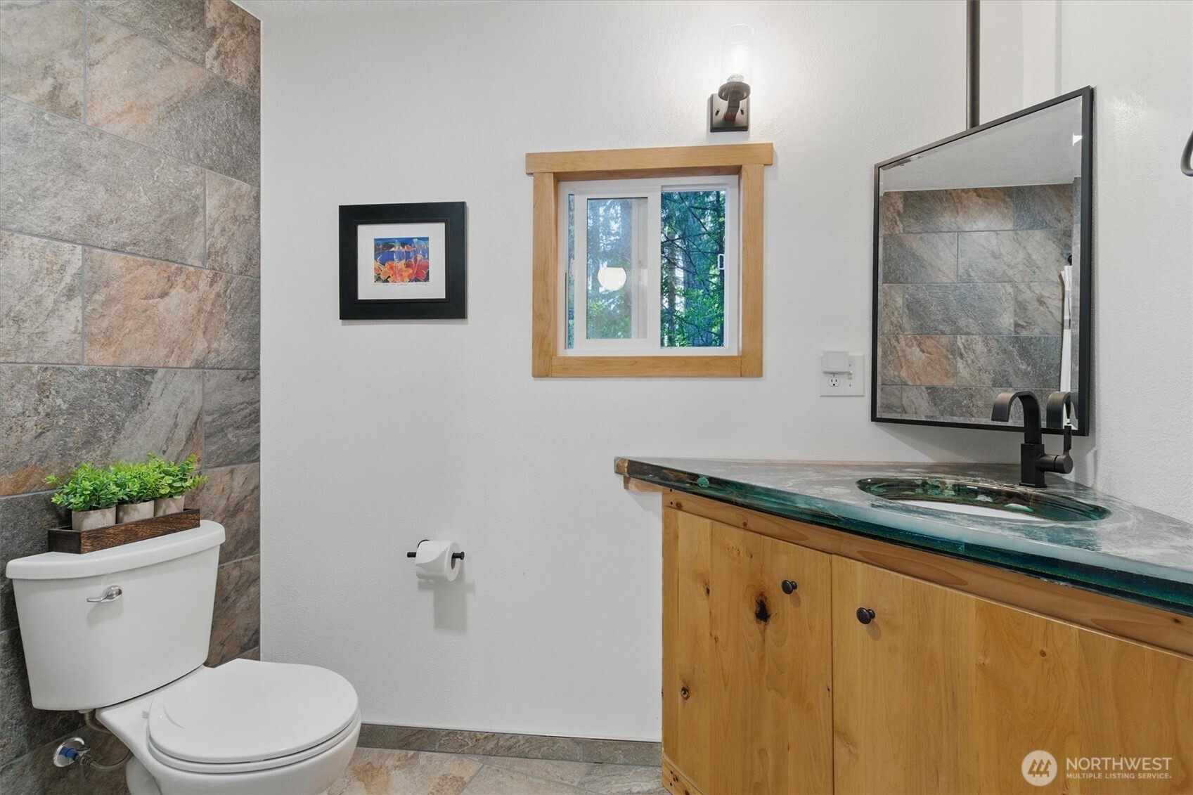 6570 East Grapeview Loop Road Allyn, WA 98524 - Photo 22 of 38 a bathroom with a granite countertop toilet sink and mirror