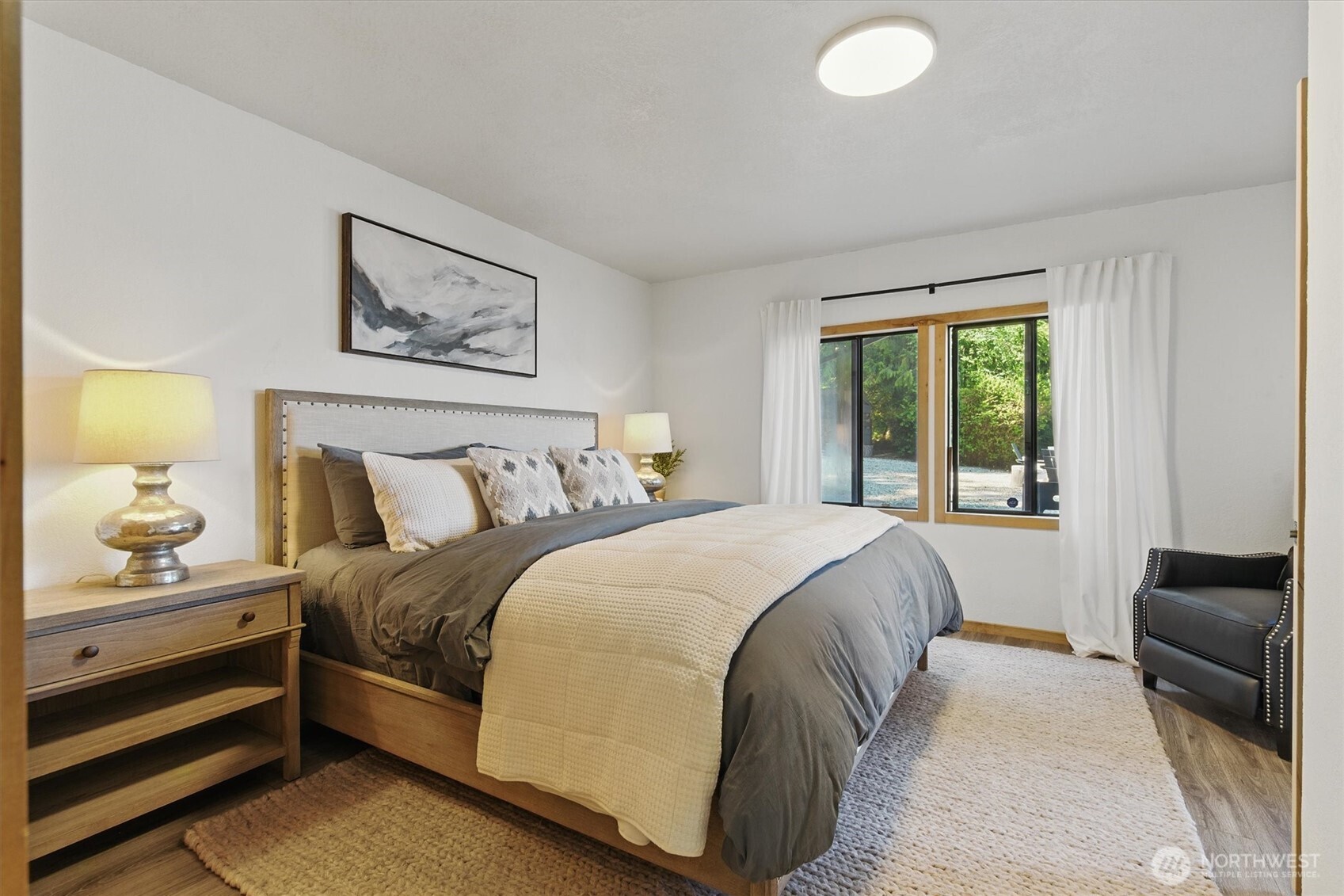 6570 East Grapeview Loop Road Allyn, WA 98524 - Photo 23 of 38 a bedroom with a bed and a couch