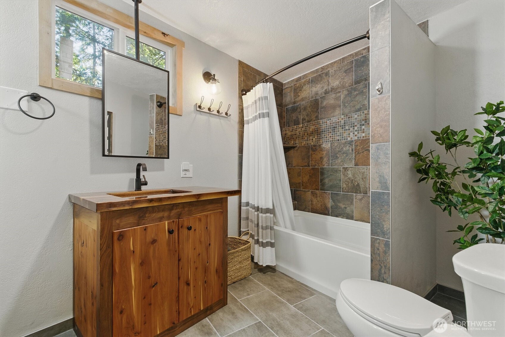 6570 East Grapeview Loop Road Allyn, WA 98524 - Photo 24 of 38 a bathroom with a sink toilet and shower