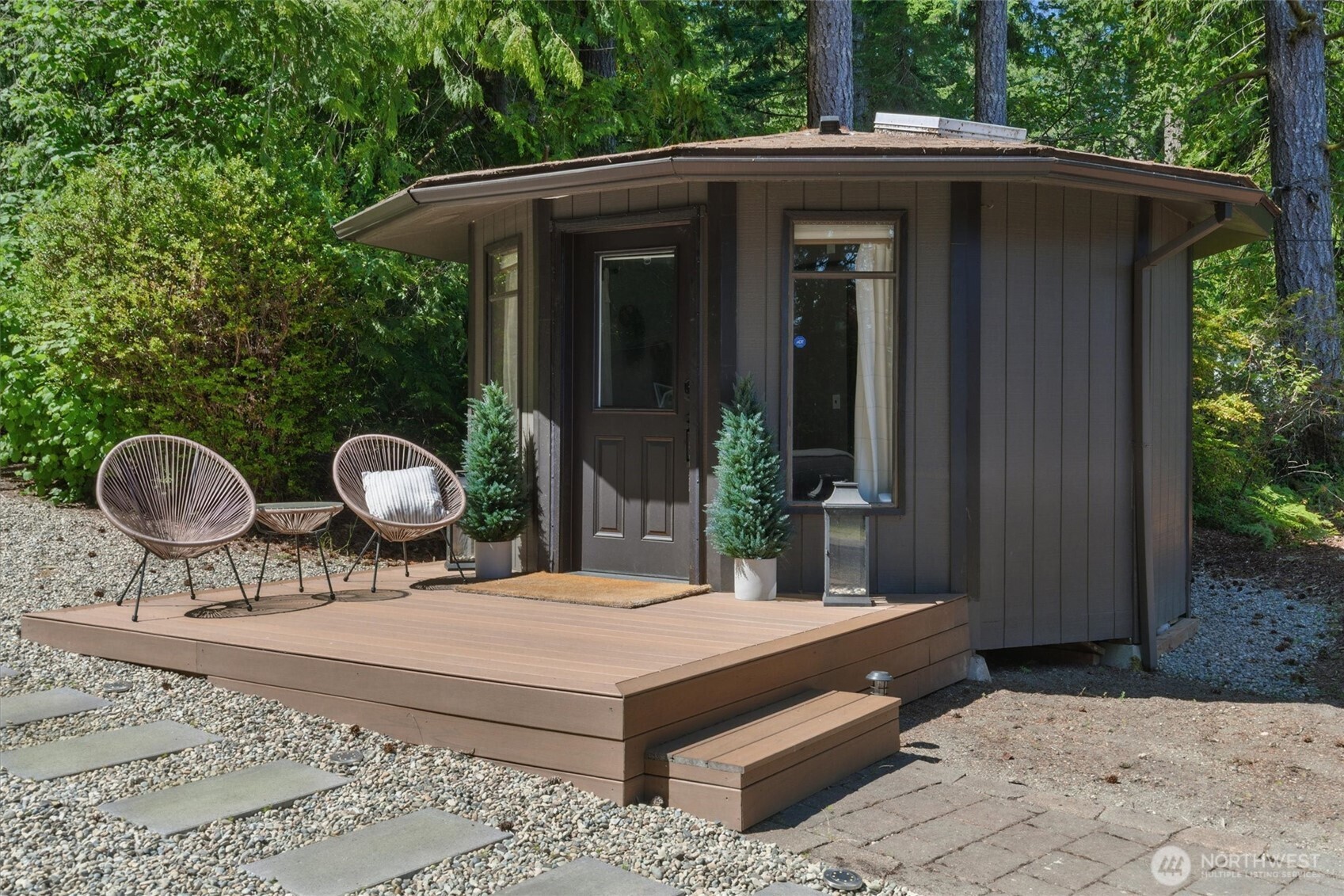 6570 East Grapeview Loop Road Allyn, WA 98524 - Photo 27 of 38 a front view of a house with garden