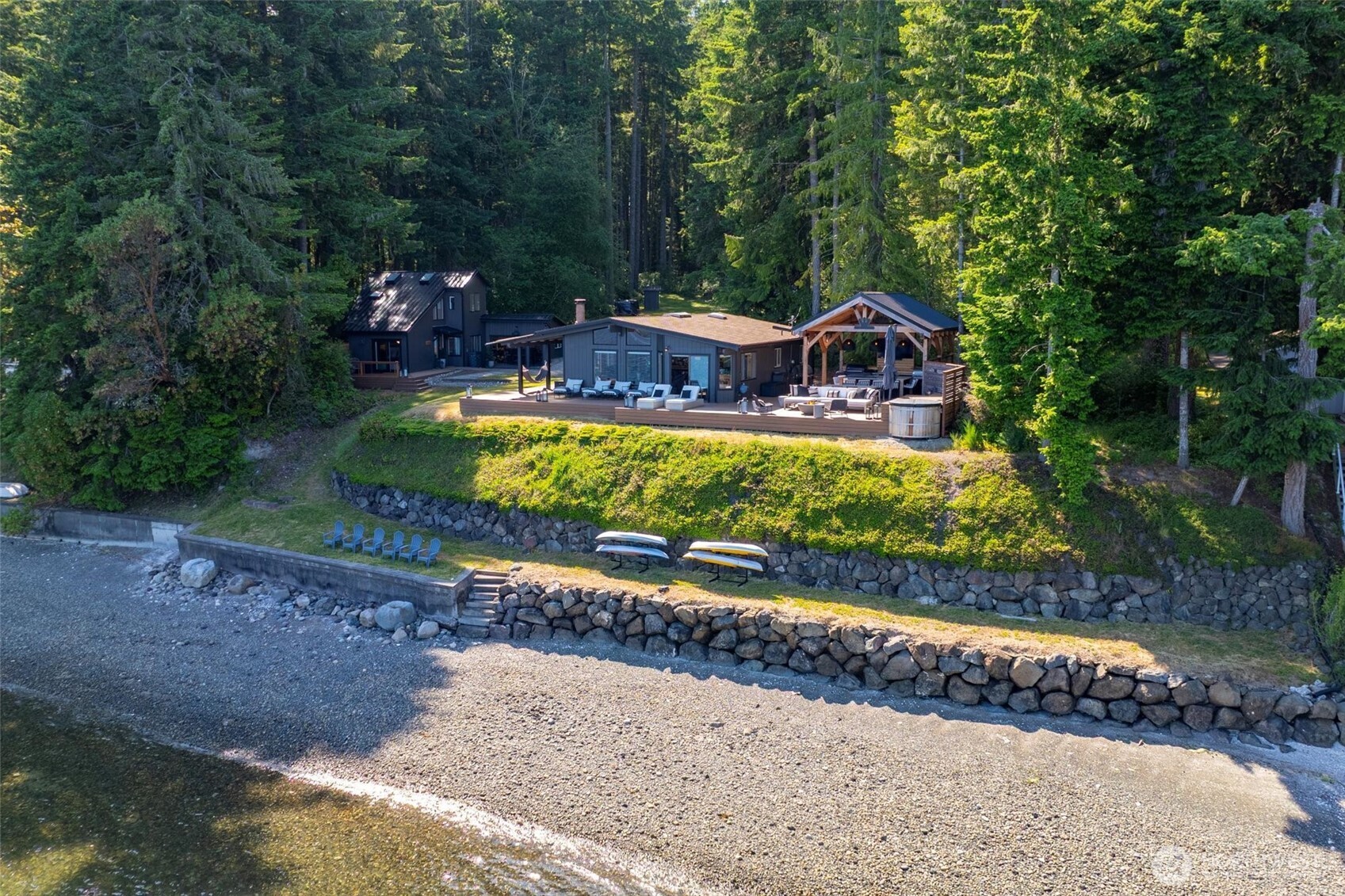 6570 East Grapeview Loop Road Allyn, WA 98524 - Photo 28 of 38 a front view of a house with a yard