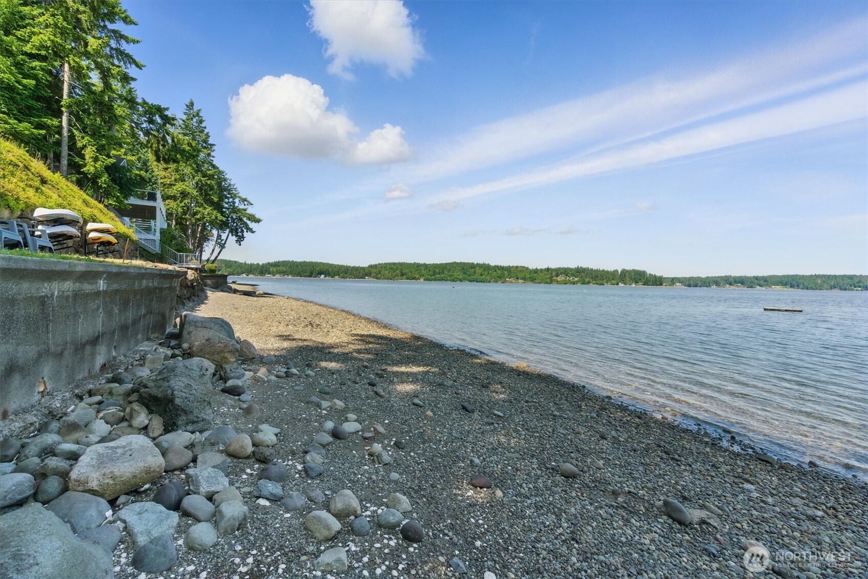 6570 East Grapeview Loop Road Allyn, WA 98524 - Photo 30 of 38 a view of a lake with houses in the back