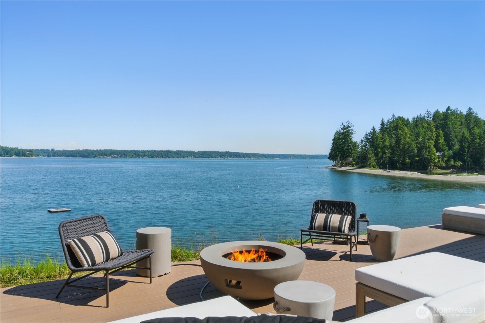 6570 East Grapeview Loop Road Allyn, WA 98524 - Photo 31 of 38 a balcony with chairs and a table