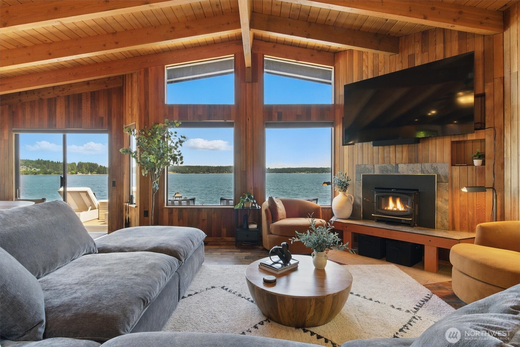 6570 East Grapeview Loop Road Allyn, WA 98524 - Photo 5 of 38 a living room with furniture and a fireplace