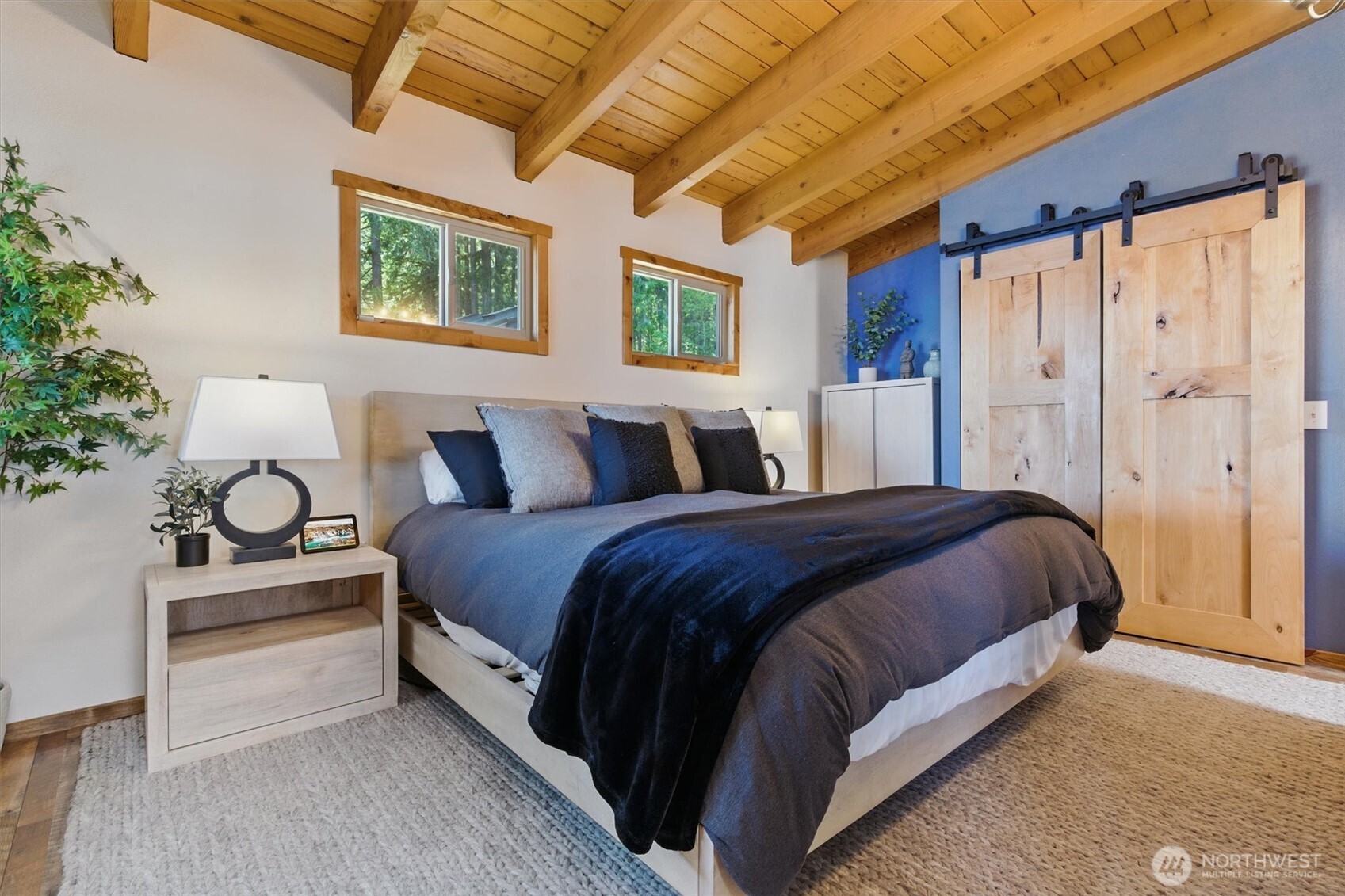 6570 East Grapeview Loop Road Allyn, WA 98524 - Photo 9 of 38 a spacious bedroom with a bed and window