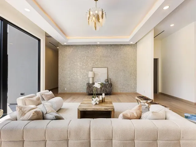 a living room with furniture and white walls