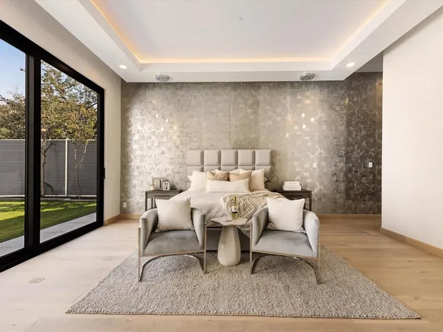 a living room with furniture lamp and window