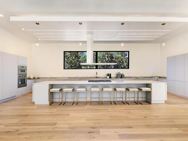 a view of a swimming pool and furniture