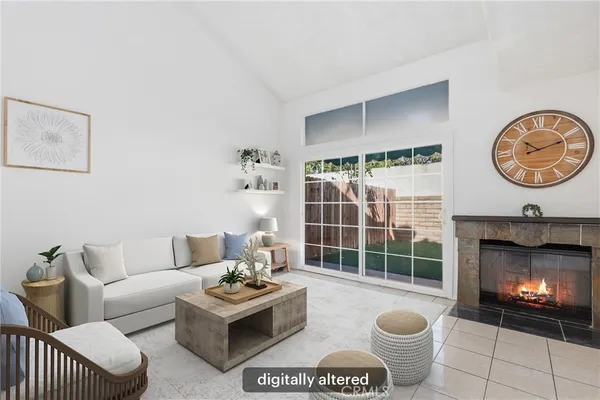 a view of a room with furniture and a fireplace