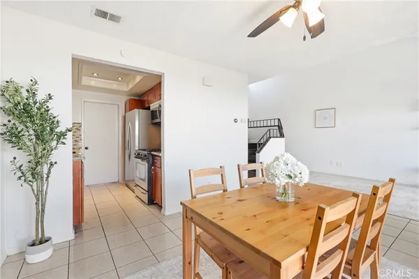 a view of a big room with wooden floor and windows
