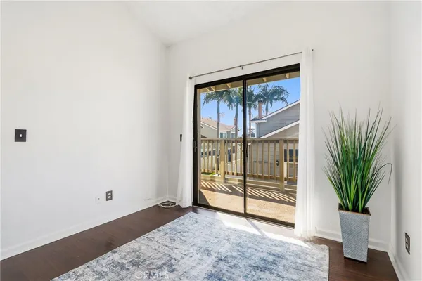 a view of a house with a yard and wooden fence