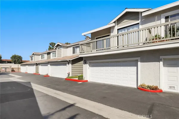 a view of a livingroom with wooden floor and white walls