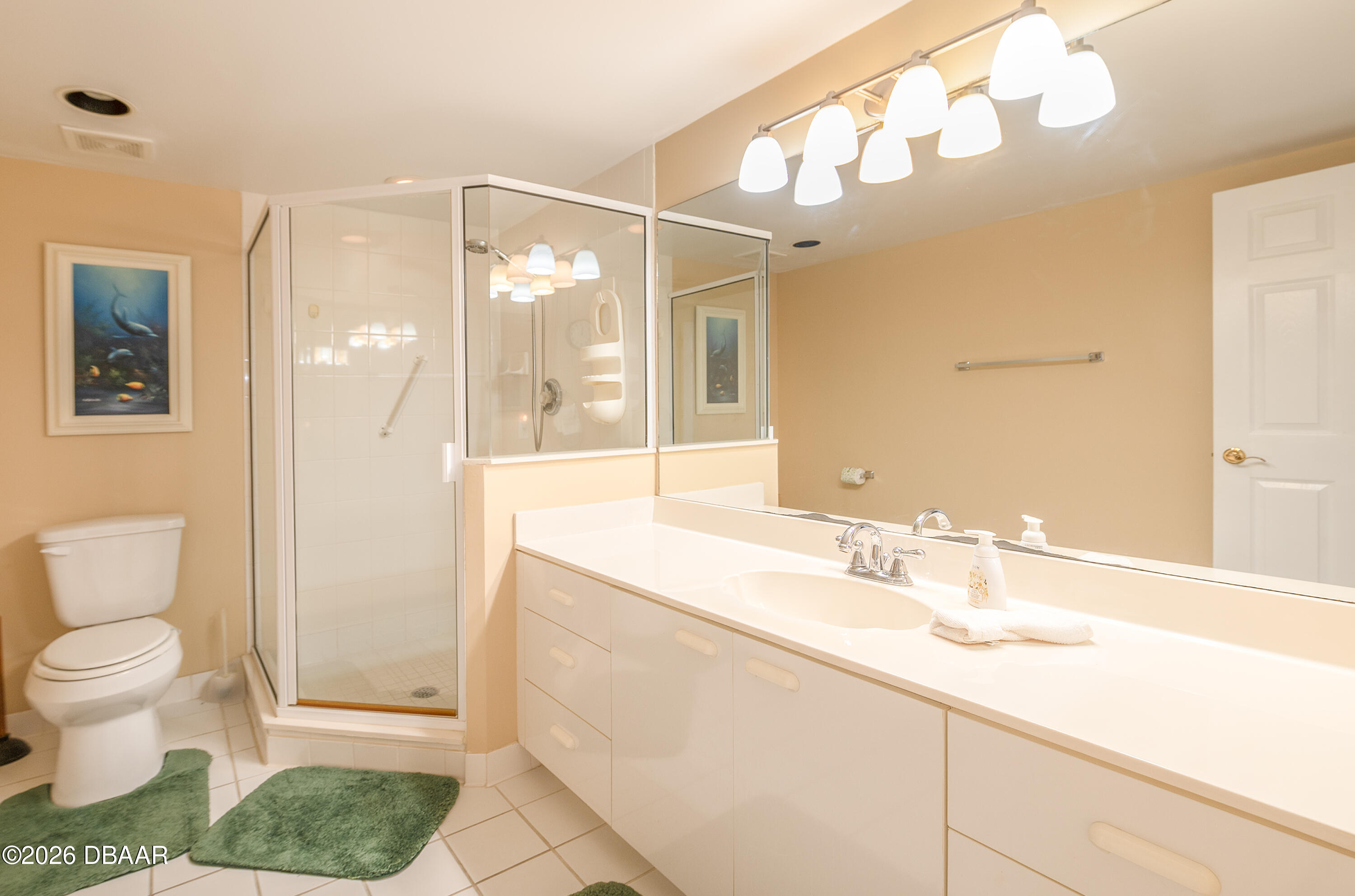 4575 South Atlantic Avenue, Unit 6701 Ponce Inlet, FL 32127 - Photo 28 of 35 a bathroom with a sink a toilet and shower