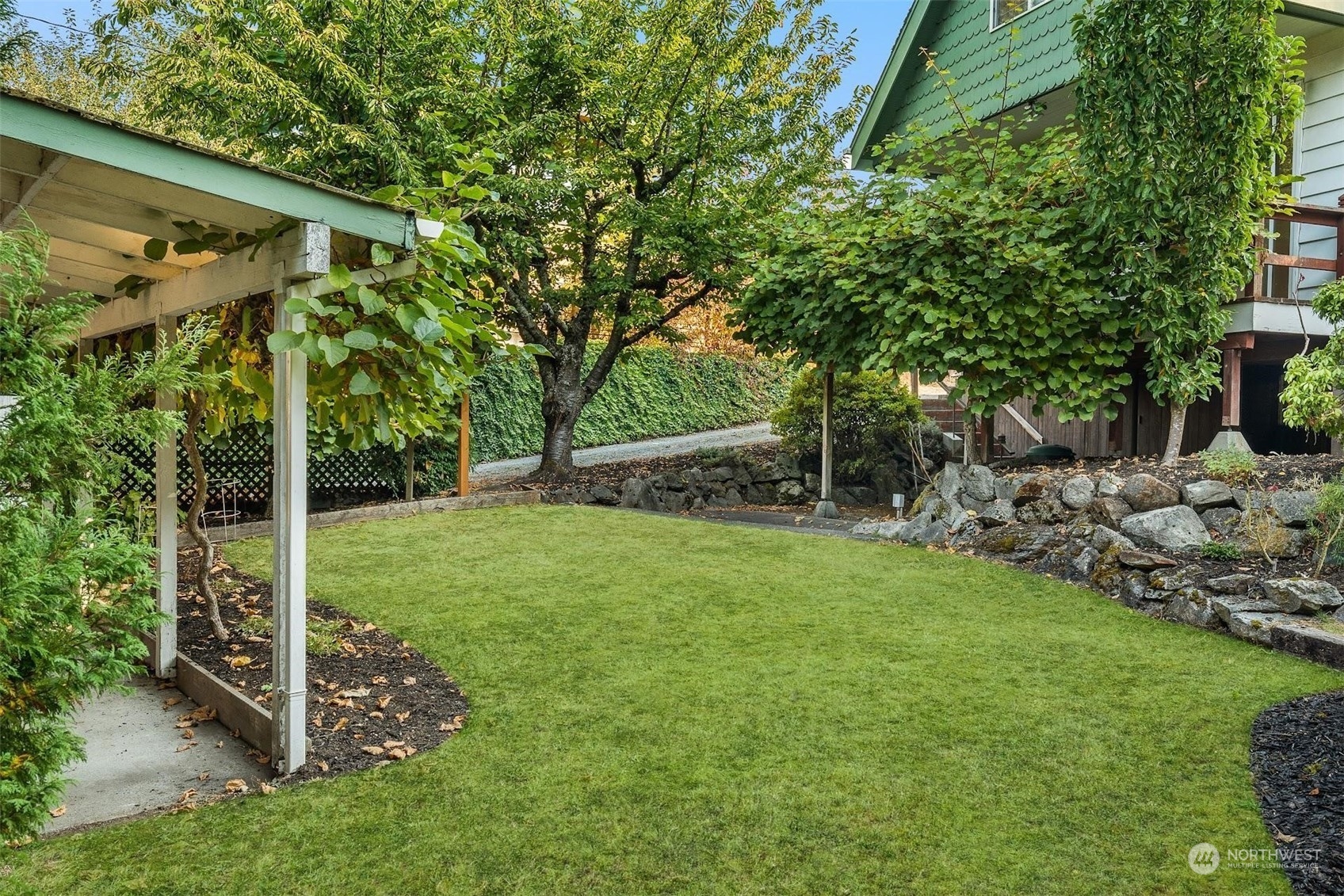 7518 Orin Court North Seattle, WA 98103 - Photo 11 of 40 a view of a chair and tables in the garden