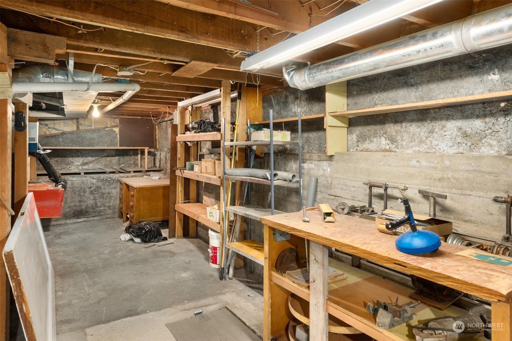 7518 Orin Court North Seattle, WA 98103 - Photo 14 of 40 a storage room with washer and dryer