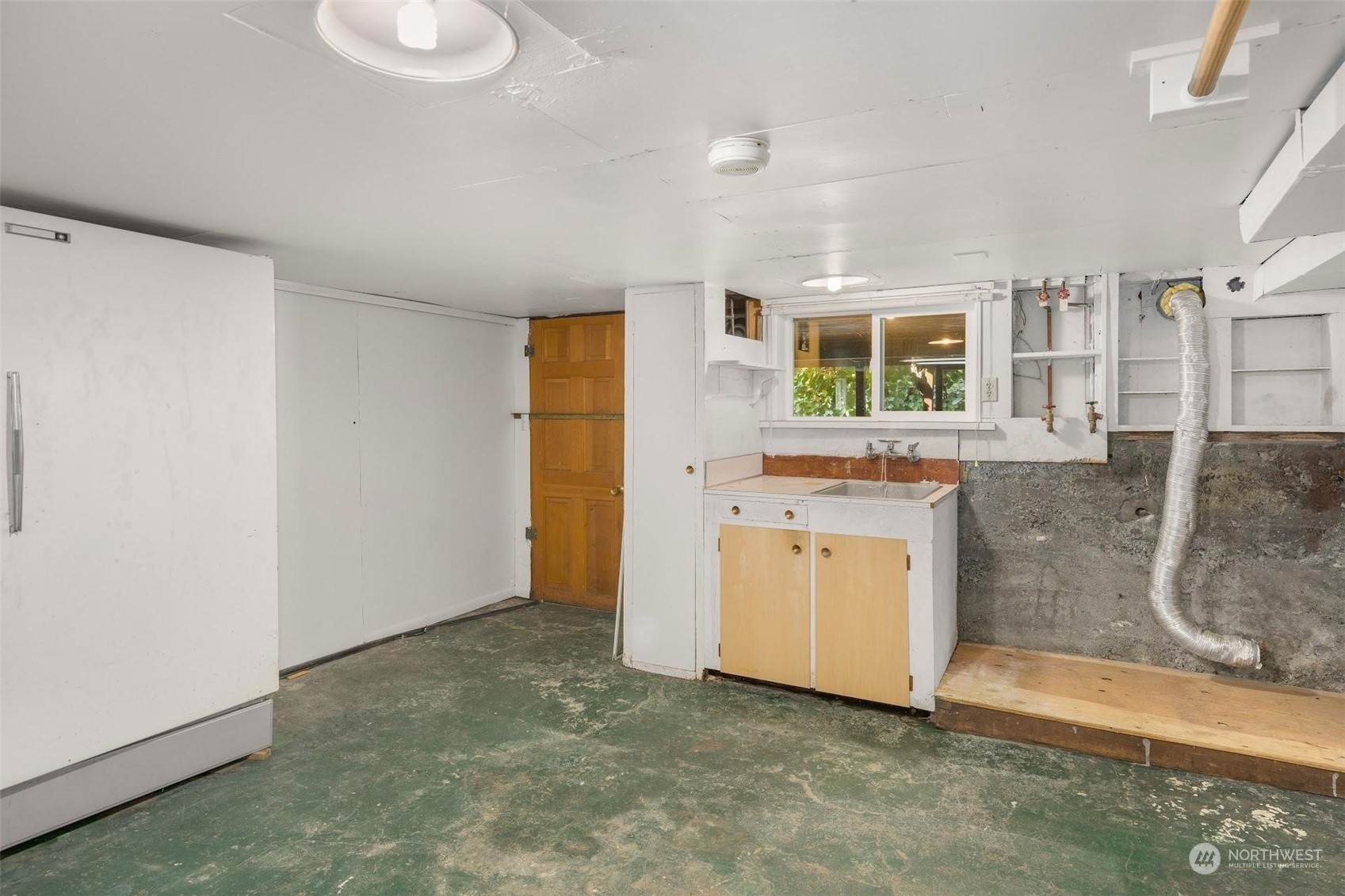 7518 Orin Court North Seattle, WA 98103 - Photo 16 of 40 a view of a bathroom with a sink and a mirror