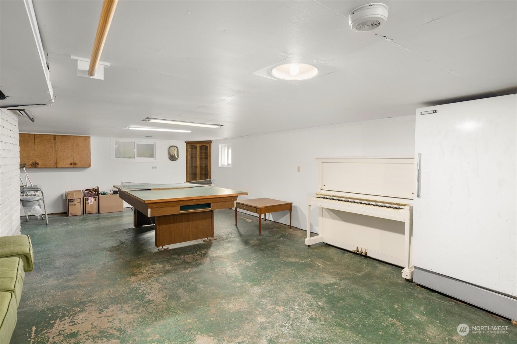 7518 Orin Court North Seattle, WA 98103 - Photo 17 of 40 a room with furniture and a window