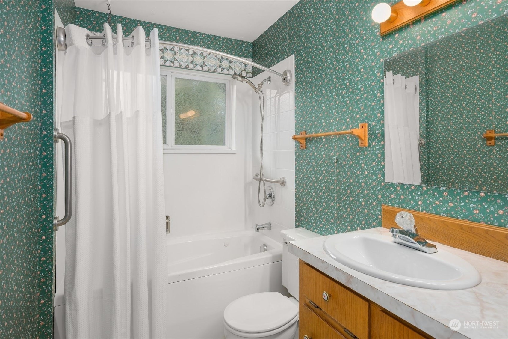 7518 Orin Court North Seattle, WA 98103 - Photo 19 of 40 a bathroom with a sink toilet and shower