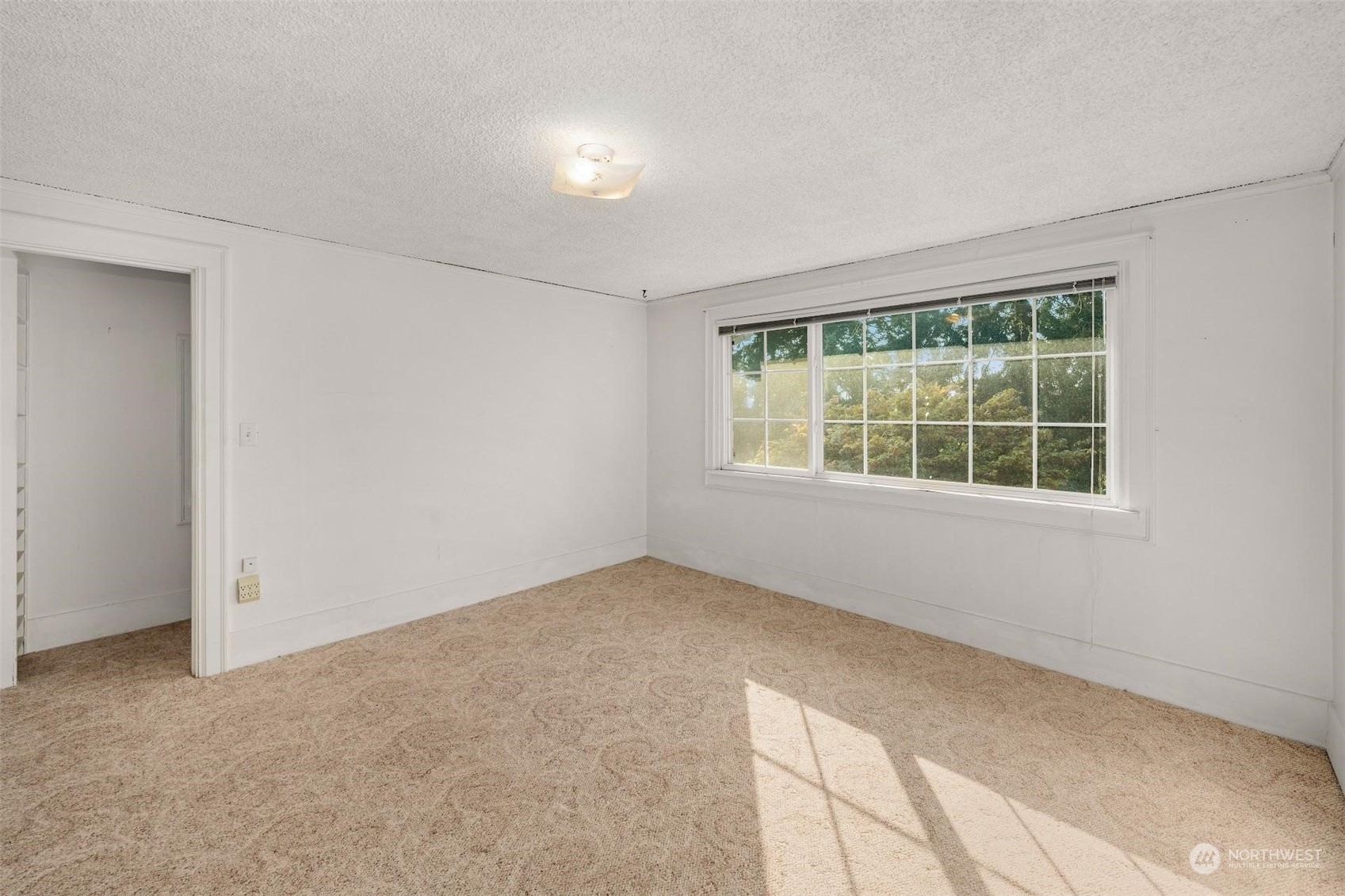 7518 Orin Court North Seattle, WA 98103 - Photo 20 of 40 an empty room with a window