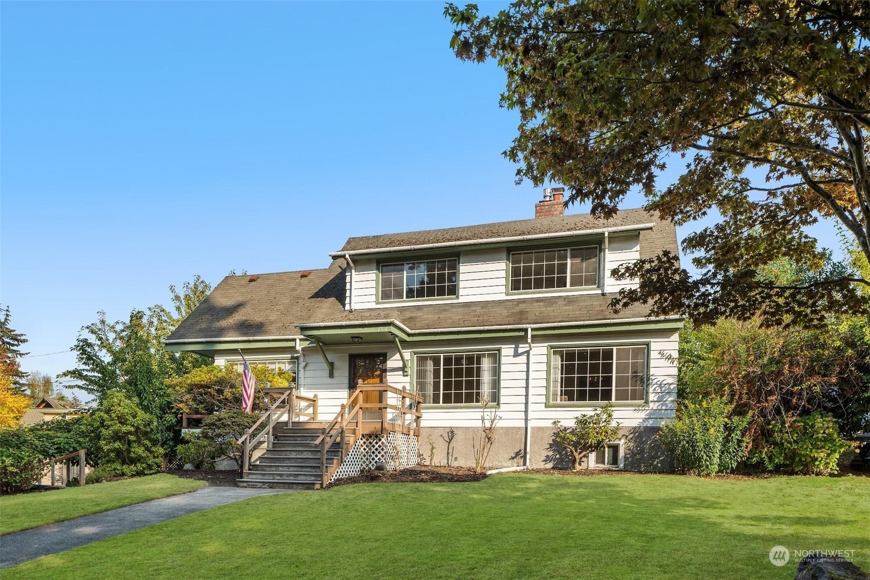 7518 Orin Court North Seattle, WA 98103 - Photo 2 of 40 a front view of house with yard and green space