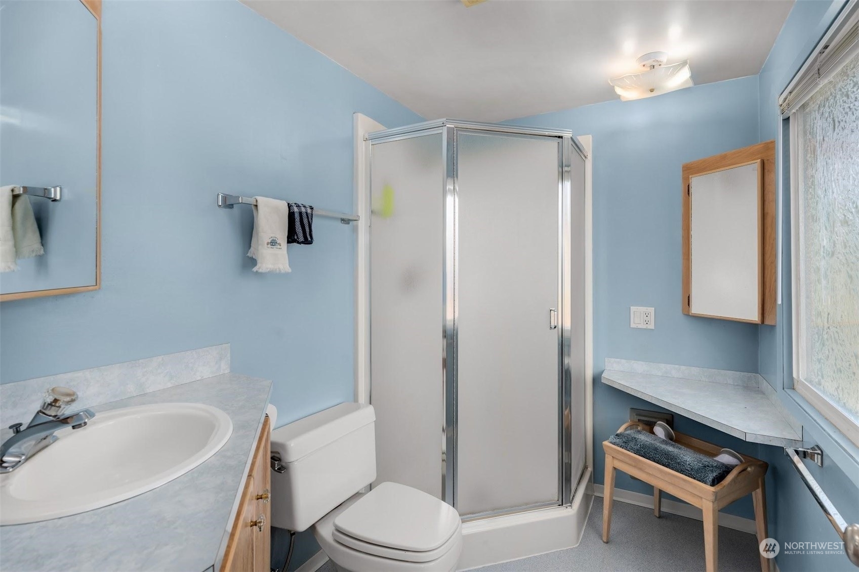 7518 Orin Court North Seattle, WA 98103 - Photo 24 of 40 a bathroom with a sink toilet and shower