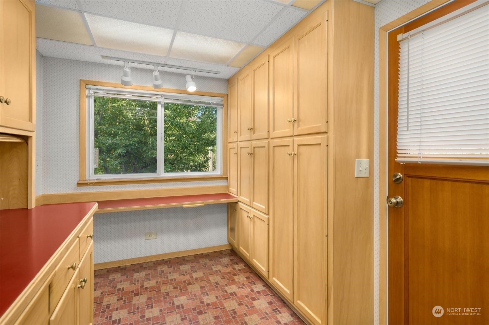 7518 Orin Court North Seattle, WA 98103 - Photo 28 of 40 a view of a kitchen with wooden floor and furniture