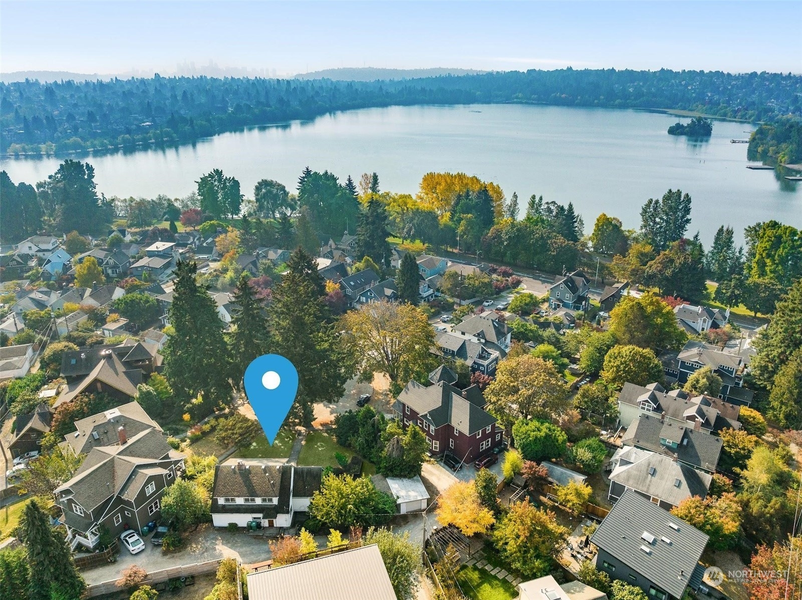 7518 Orin Court North Seattle, WA 98103 - Photo 3 of 40 a view of a lake with a mountain and a lake view