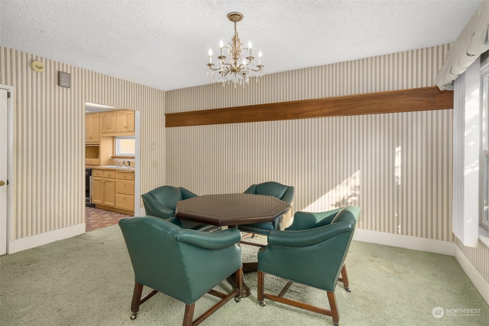7518 Orin Court North Seattle, WA 98103 - Photo 32 of 40 a living room with furniture and a chandelier