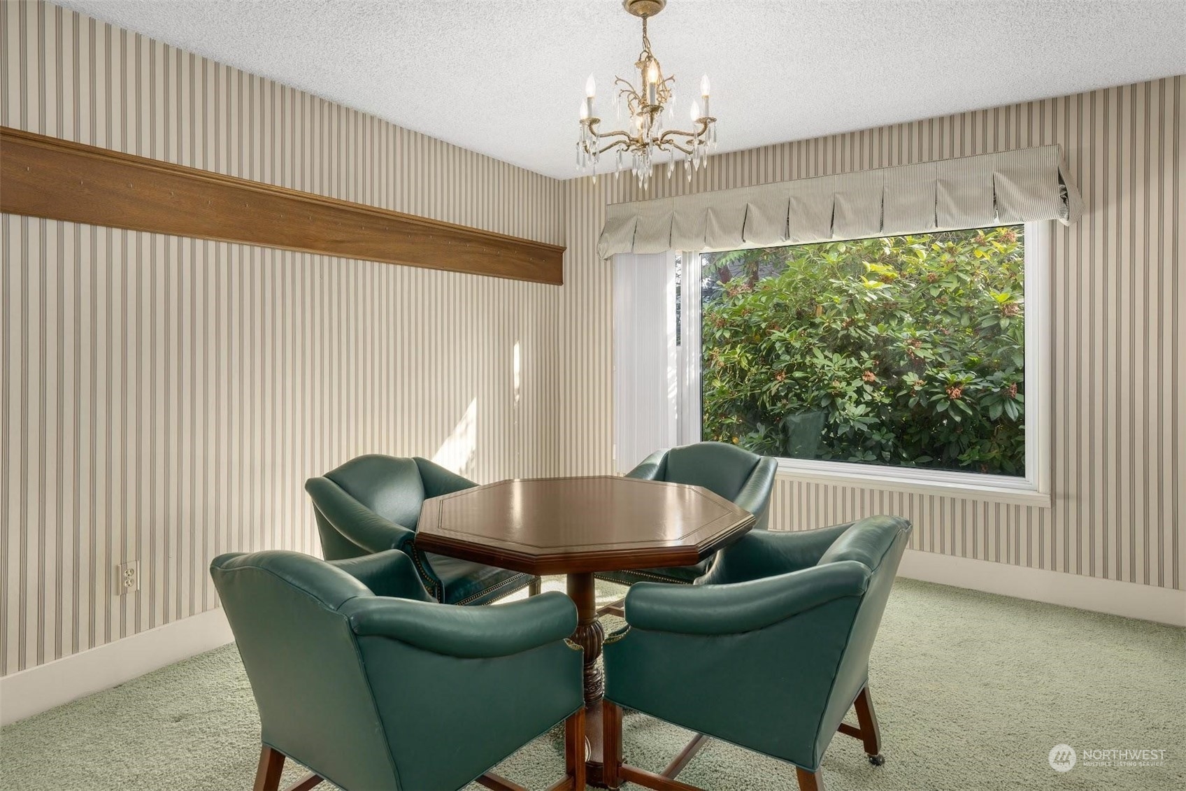 7518 Orin Court North Seattle, WA 98103 - Photo 33 of 40 a view of a dining room with furniture window and outside view