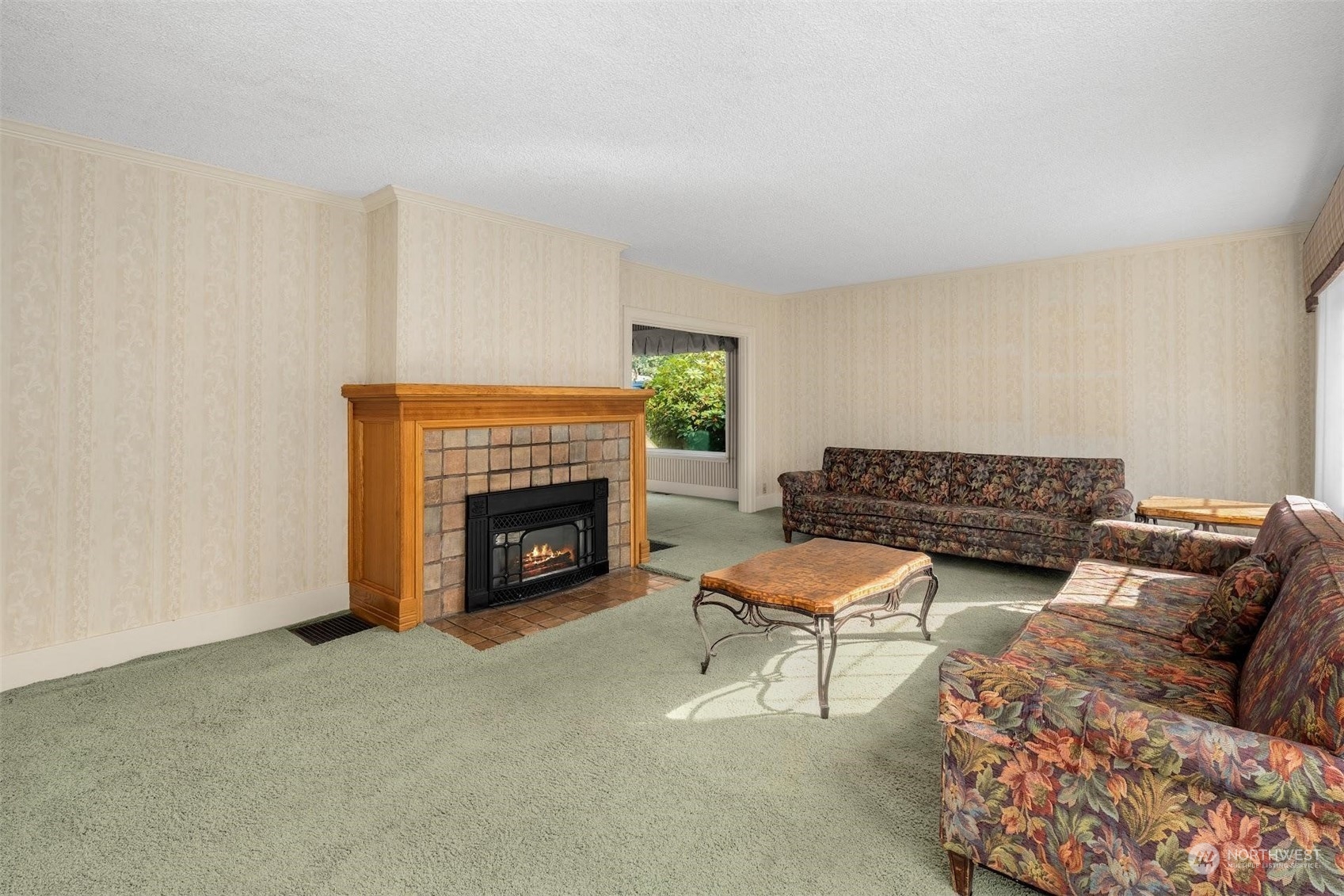 7518 Orin Court North Seattle, WA 98103 - Photo 36 of 40 a living room with furniture and a fireplace