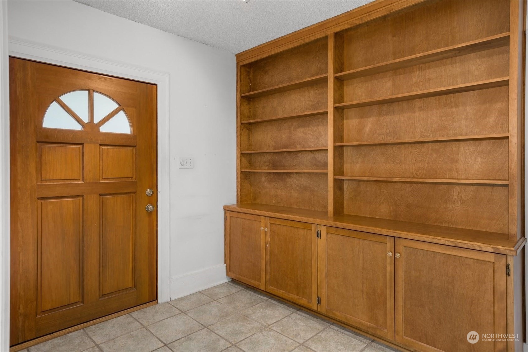 7518 Orin Court North Seattle, WA 98103 - Photo 37 of 40 a wooden door with a glass door