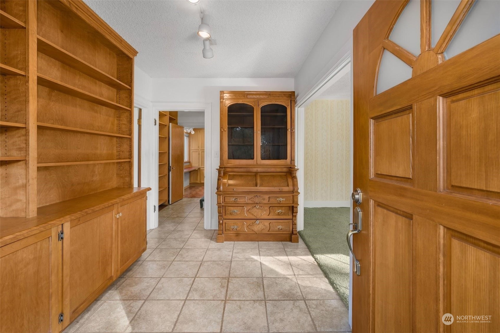 7518 Orin Court North Seattle, WA 98103 - Photo 38 of 40 a view of walk in closet and bedroom