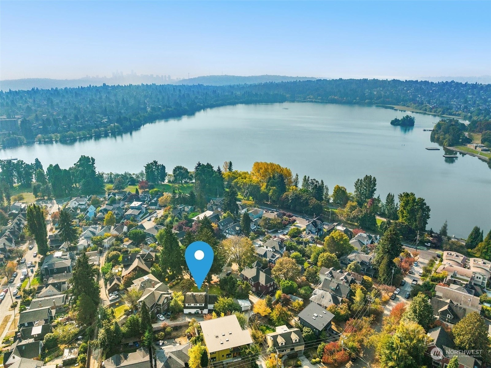 7518 Orin Court North Seattle, WA 98103 - Photo 4 of 40 a aerial view of a house with a lake view
