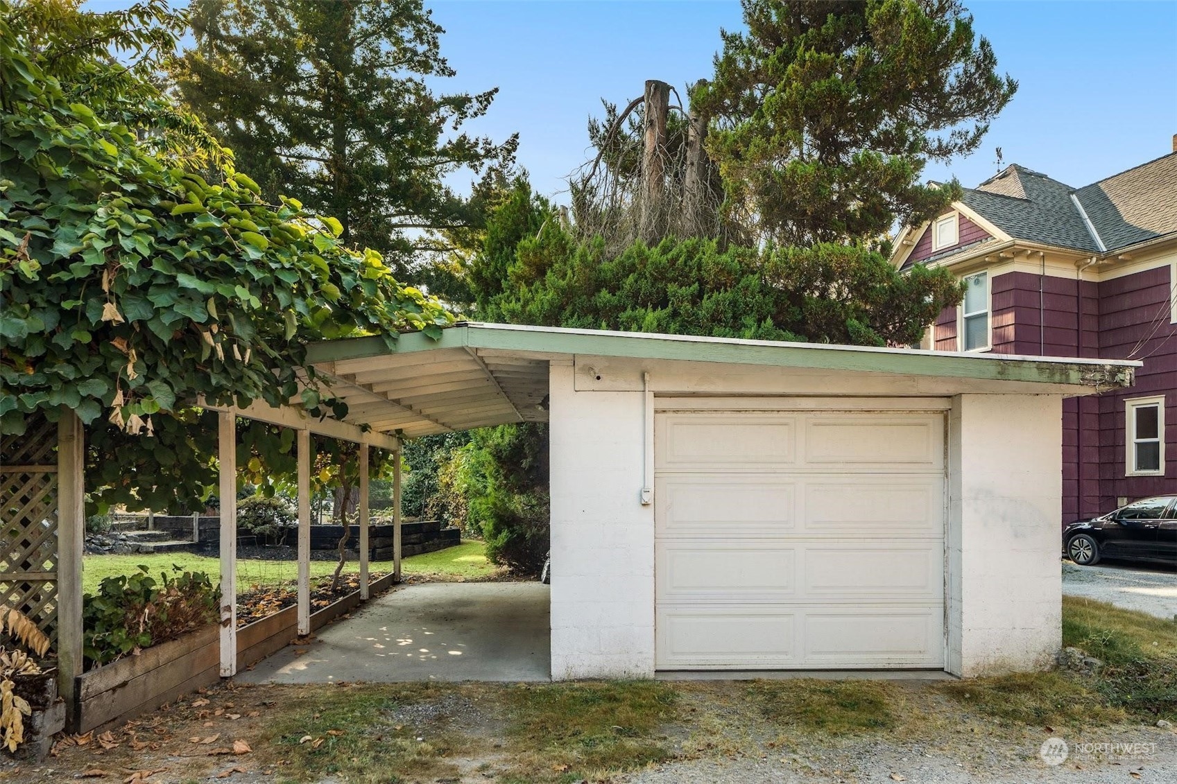 7518 Orin Court North Seattle, WA 98103 - Photo 7 of 40 a view of a small house in the middle of a yard