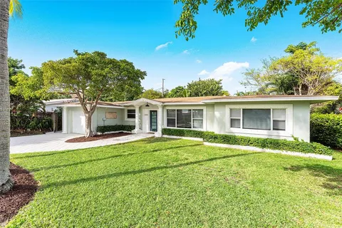 front view of a house with a garden