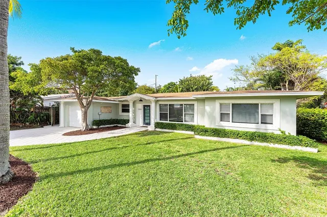 front view of a house with a garden