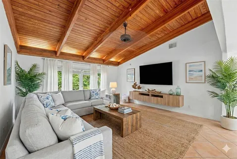 a bathroom with a granite countertop toilet sink and mirror