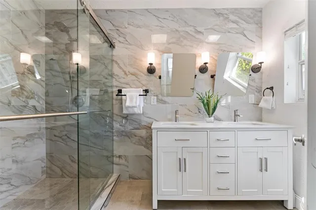 a bathroom with a sink and mirror
