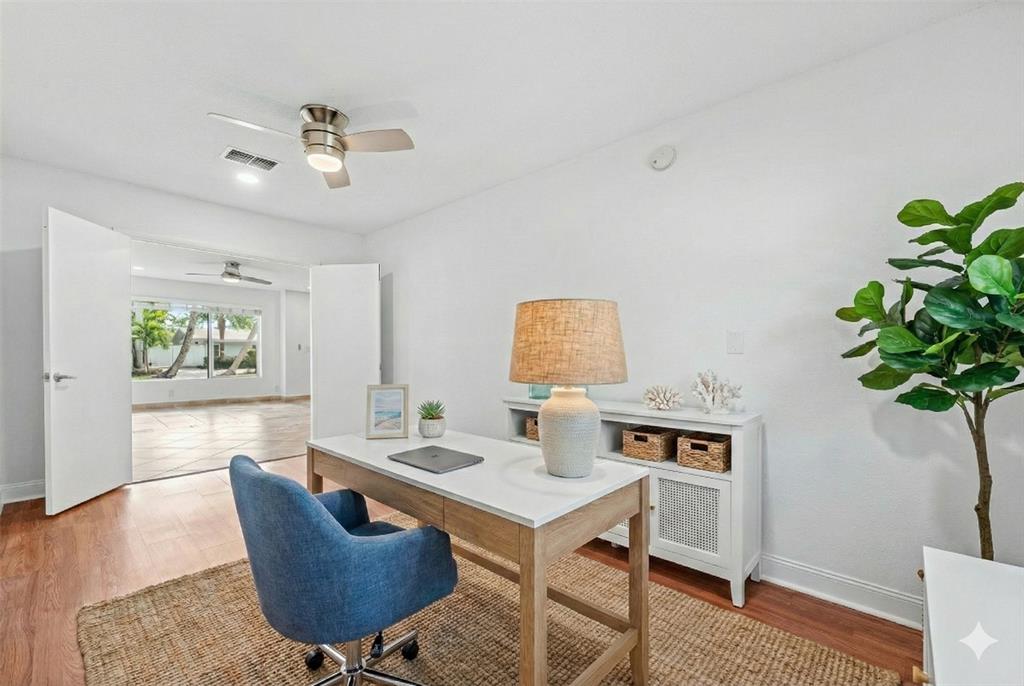 3203 Dover Road Pompano Beach, FL 33062 - Photo 19 of 54 a living room with furniture a potted plant and a table