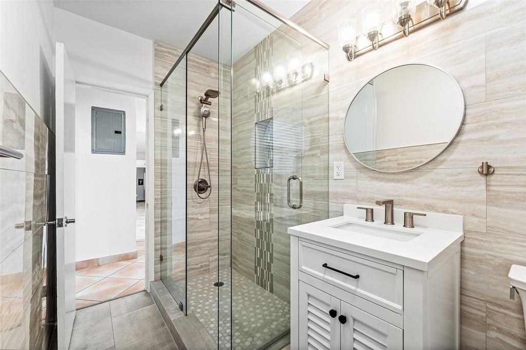 3203 Dover Road Pompano Beach, FL 33062 - Photo 22 of 54 a bathroom with a sink a toilet and shower