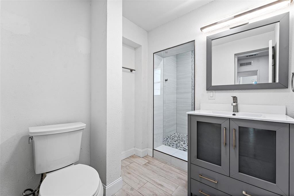 3203 Dover Road Pompano Beach, FL 33062 - Photo 24 of 54 a bathroom with a toilet sink and mirror