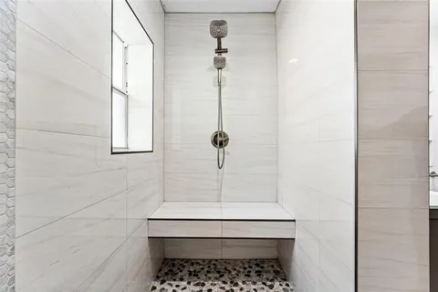 a view of a yard with plants and trees