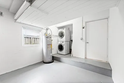 a view of a house with a yard and pathway