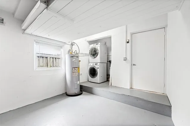 a view of a house with a yard and pathway